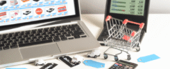 alt_text: Organized workspace with a laptop on shopping sites, shopping cart, discount tags, and calculator.